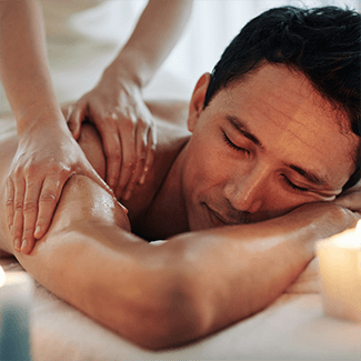 masseur performing deep tissue massage to a client in venice