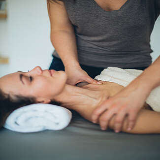 masseur performs lymphatic massage to a woman in venice