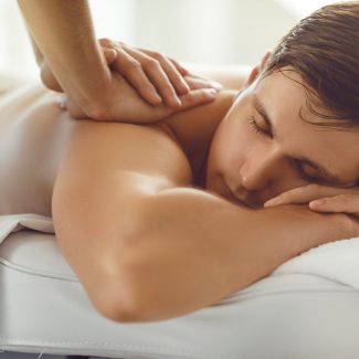 masseur performs neuromuscular massage to a man in venice