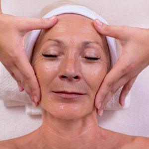 old woman relaxing facial aesthetics venice