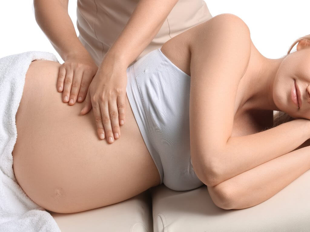 pregnant woman lying on her side prenatal massage venice 1
