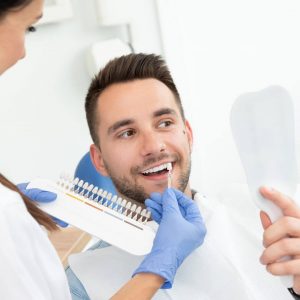 professional choosing the right color teeth whitening venice