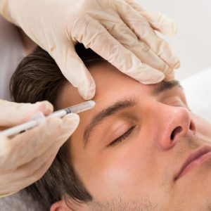 professional doing prp treatment to a male client in venice
