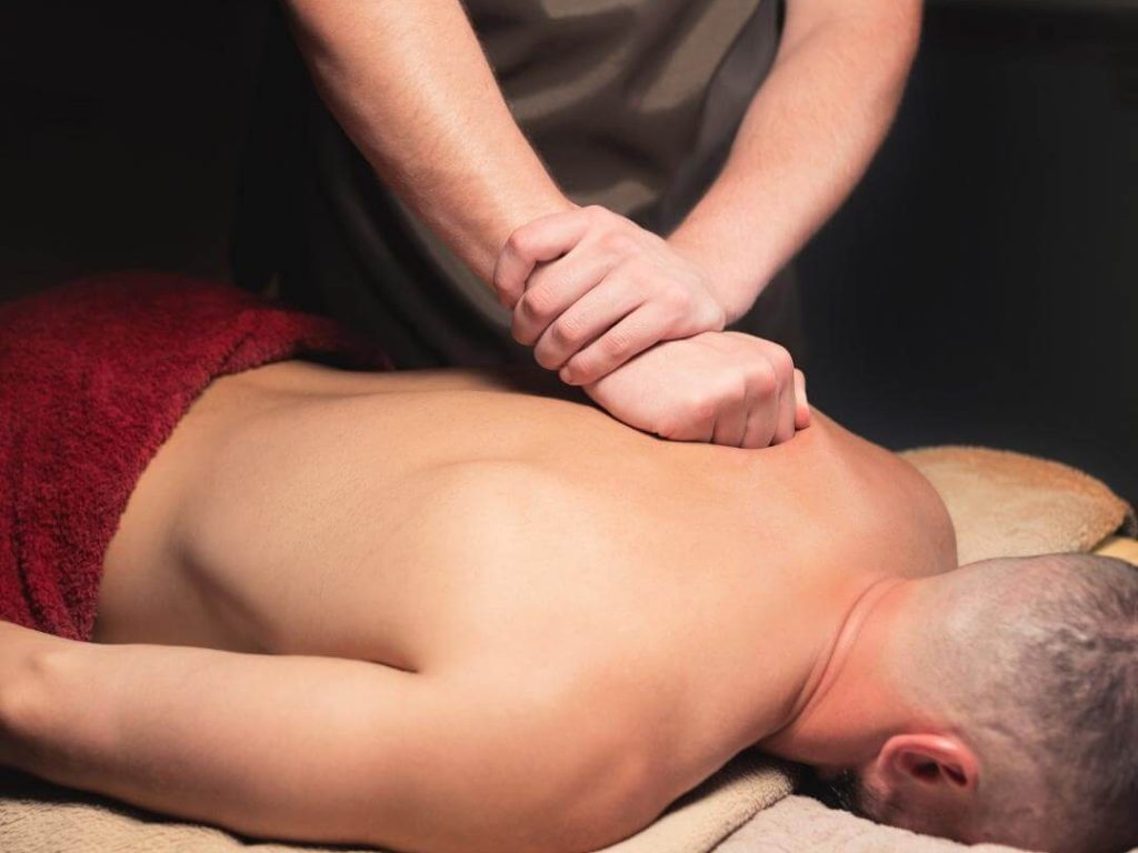 masseur performs lymphatic massage to a male client in venice 1